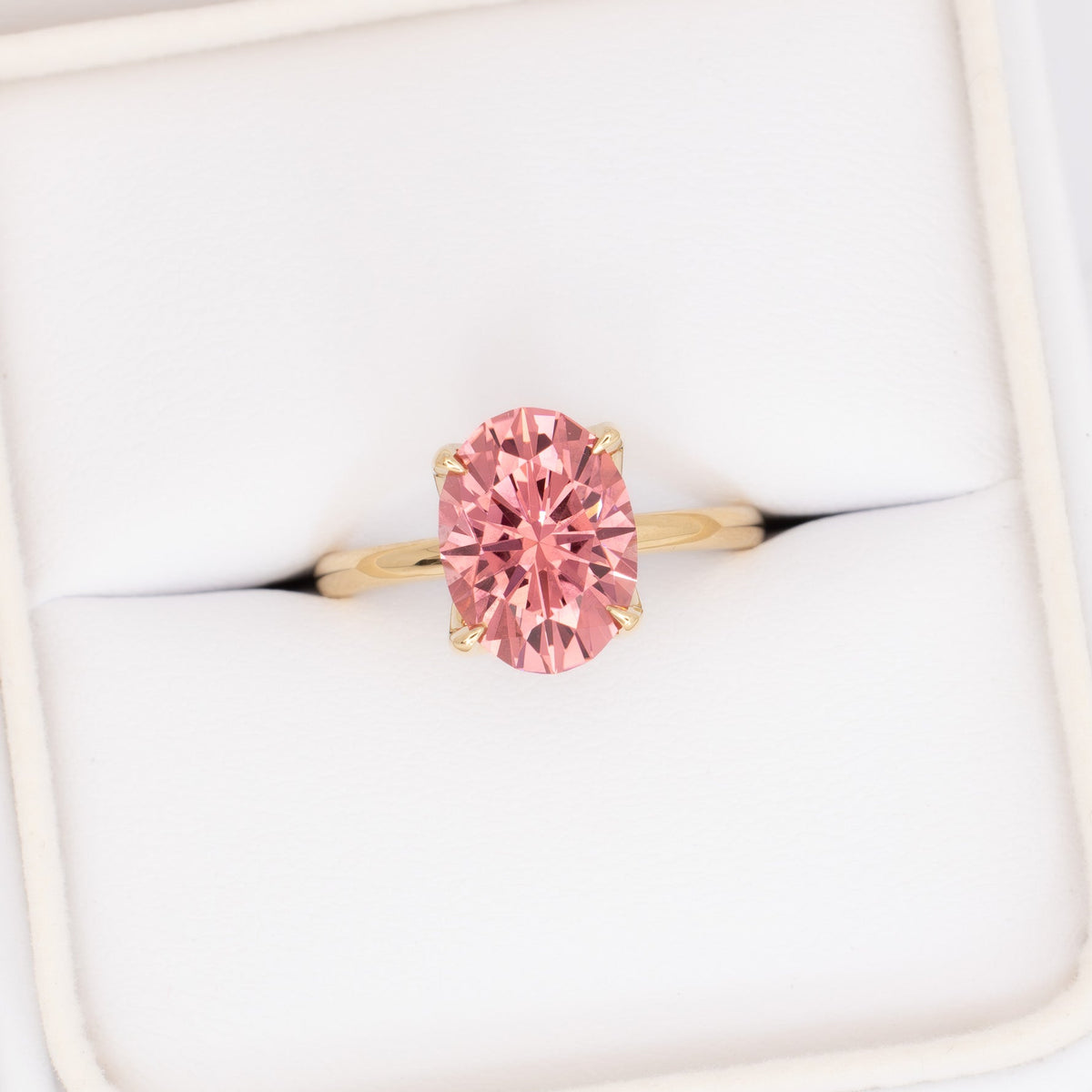 molly petal basket solitaire ring in yellow gold with oval pink lab sapphire