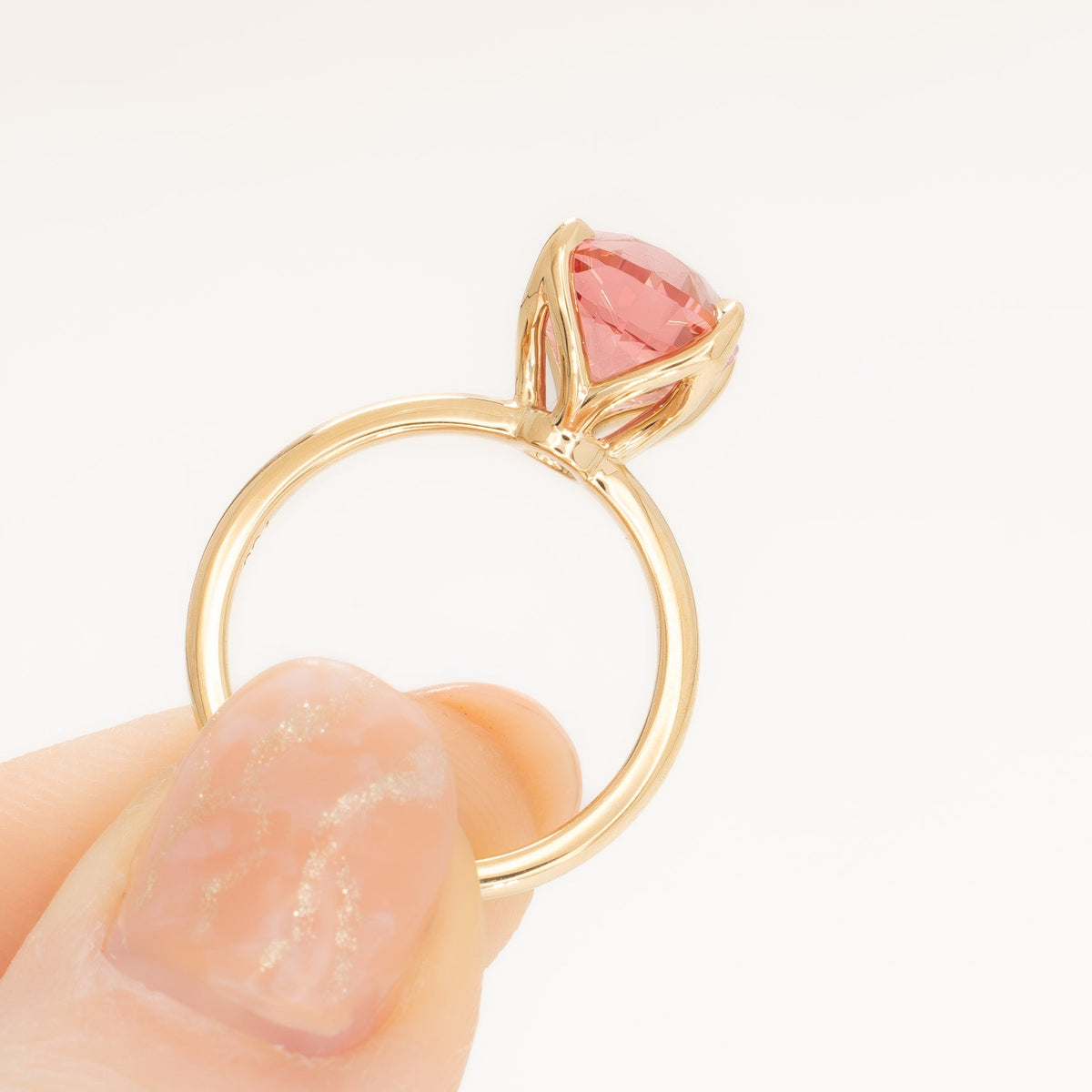 molly petal basket solitaire ring in yellow gold with oval pink lab sapphire
