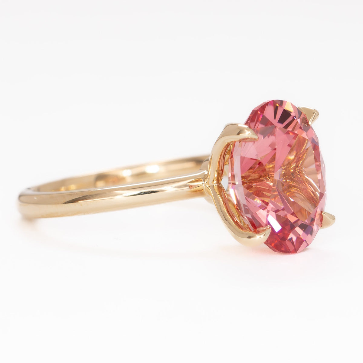 molly petal basket solitaire ring in yellow gold with oval pink lab sapphire
