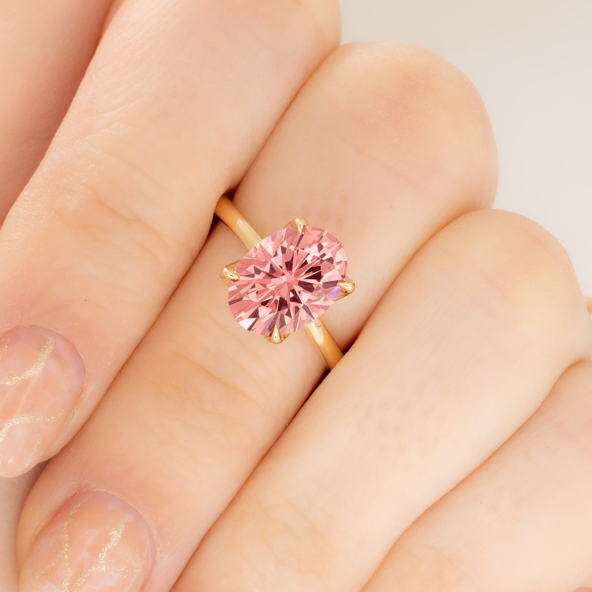 molly petal basket solitaire ring in yellow gold with oval pink lab sapphire
