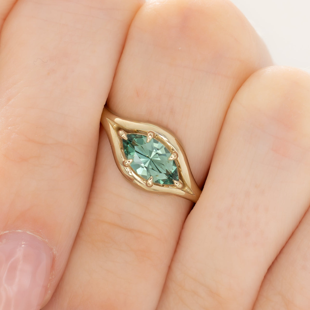 monica solitaire ring in yellow gold with juniper green lab sapphire baroness marquise