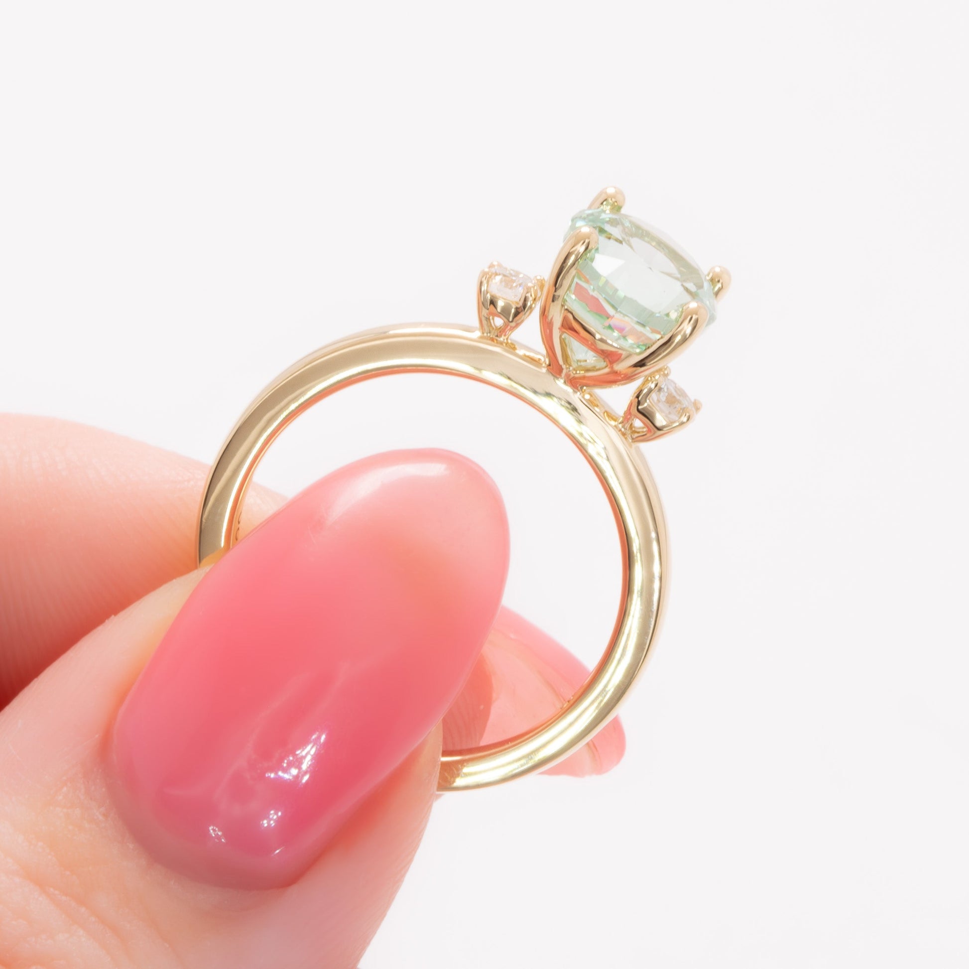 naomi three stone engagment ring with mint oval lab sapphire
