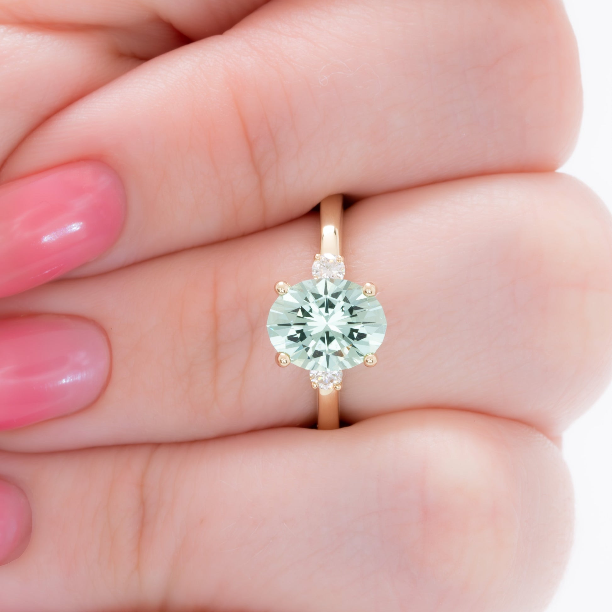 naomi three stone engagment ring with mint oval lab sapphire