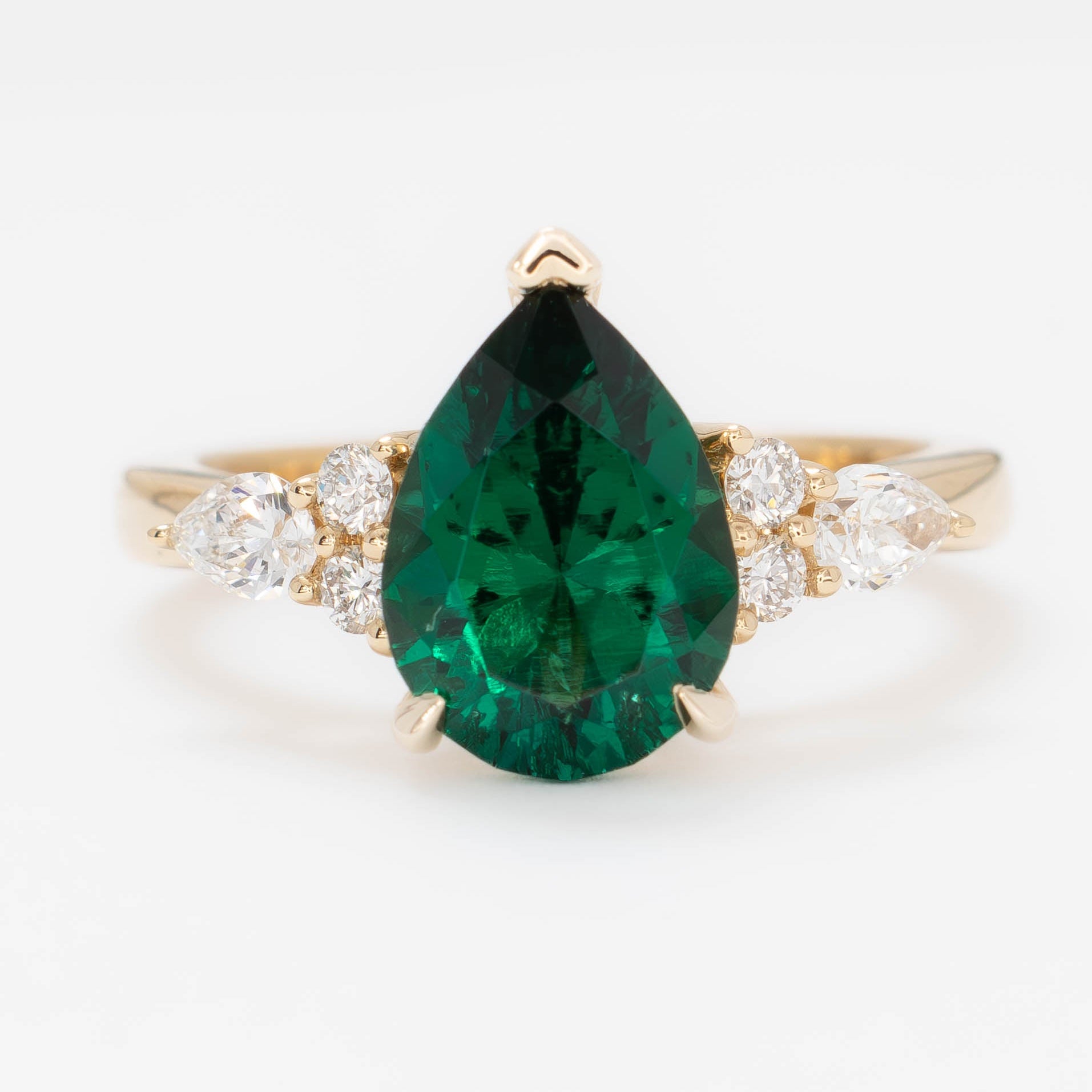 natalia wedding set in yellow gold with pear lab emerald