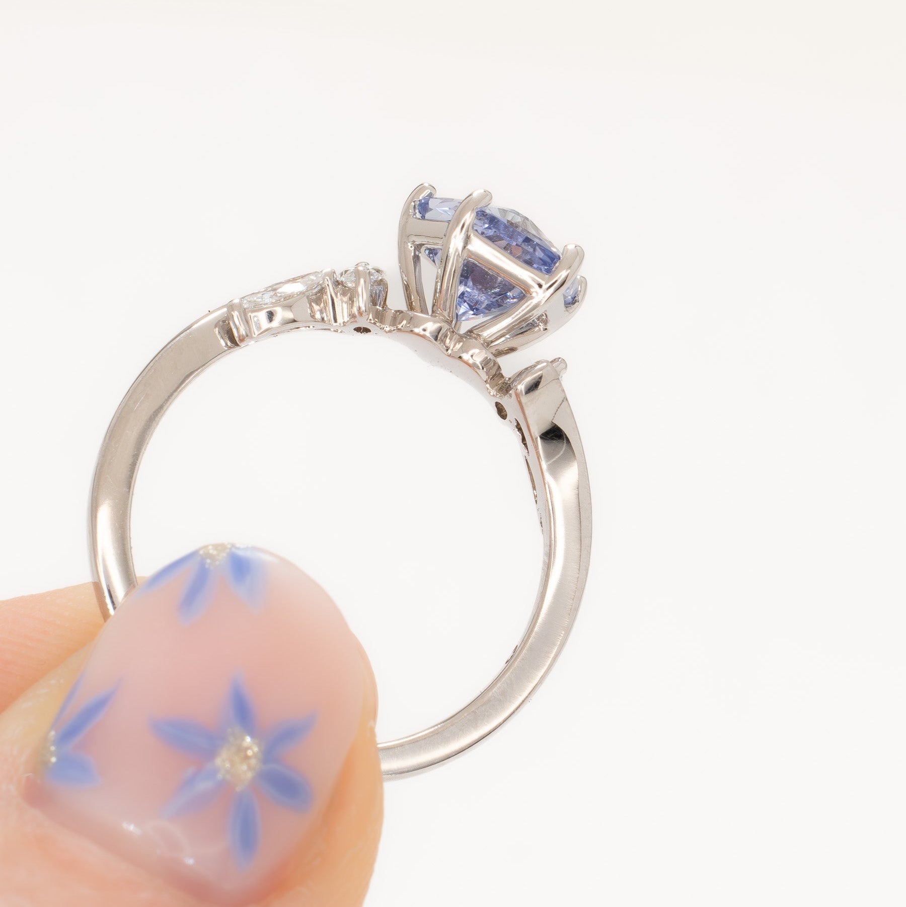 nature inspired engagement ring in white gold with light blue lab sapphire hanami pentagon