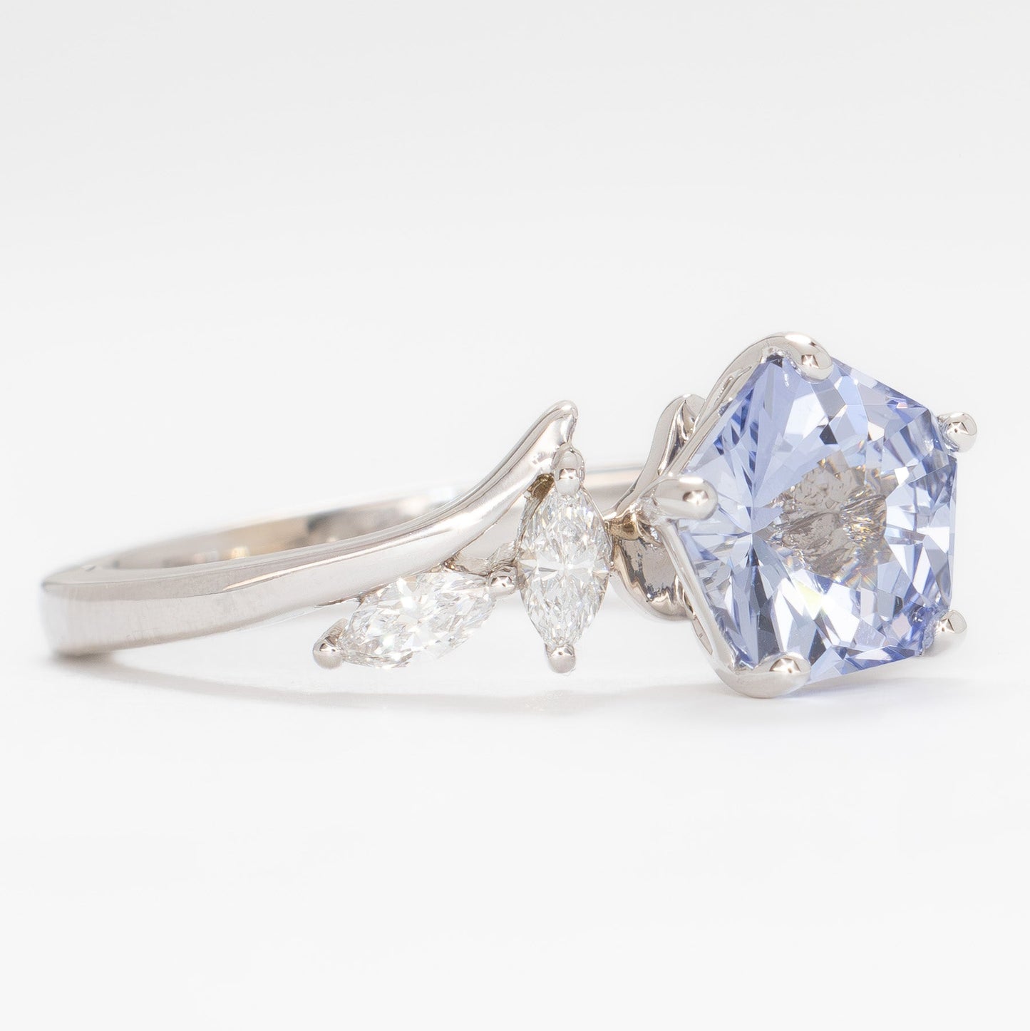 nature inspired engagement ring in white gold with light blue lab sapphire hanami pentagon