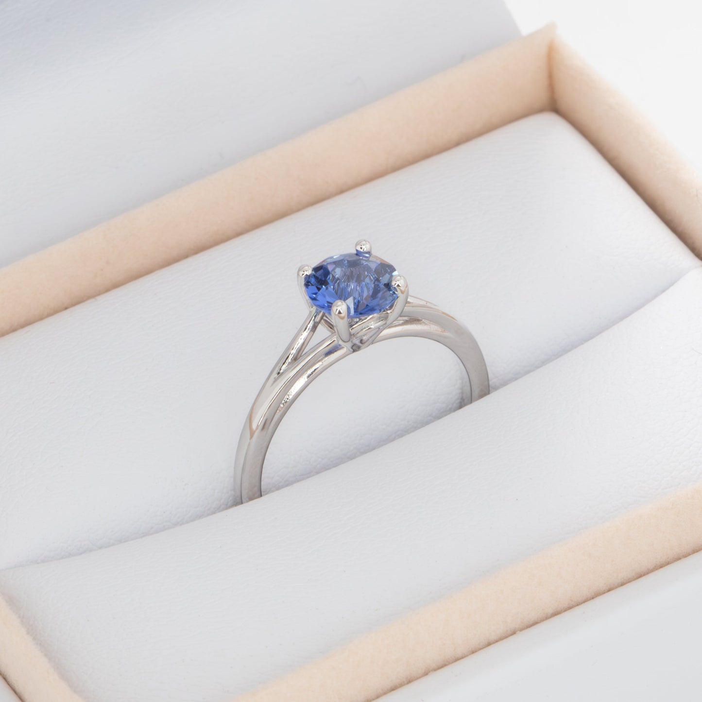 neve engagement ring with periwinkle blue round lab sapphire
