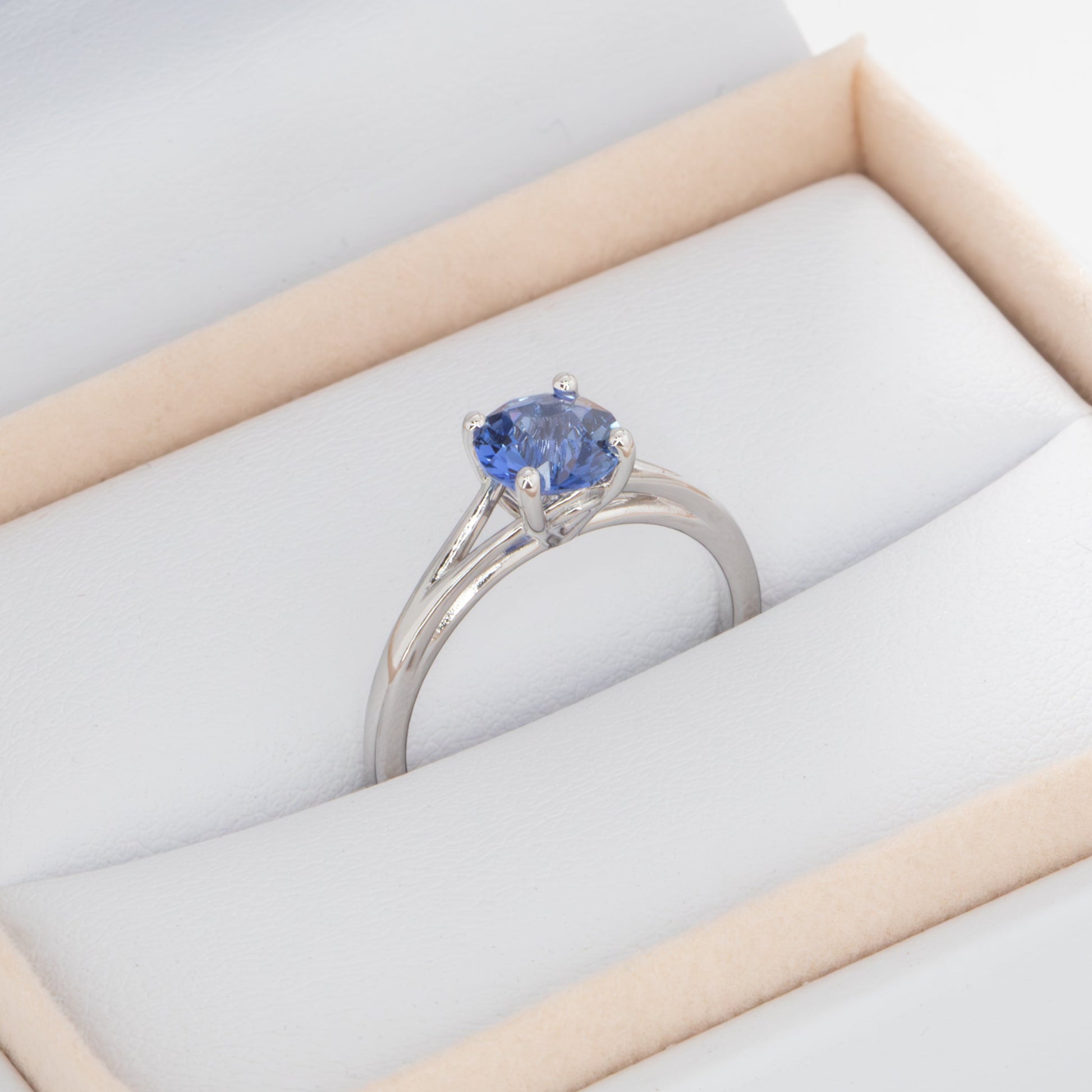 neve engagement ring with periwinkle blue round lab sapphire