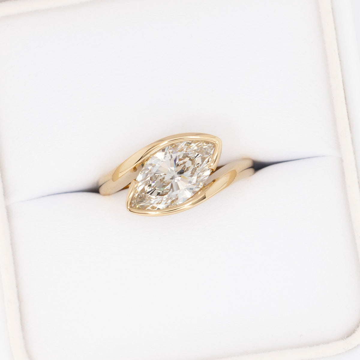 olivia bypass solitaire ring in yellow gold with marquise lab diamond