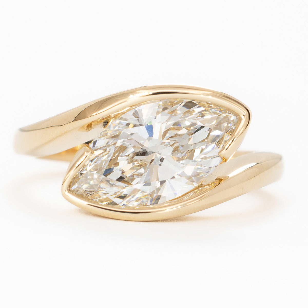 olivia bypass solitaire ring in yellow gold with marquise lab diamond