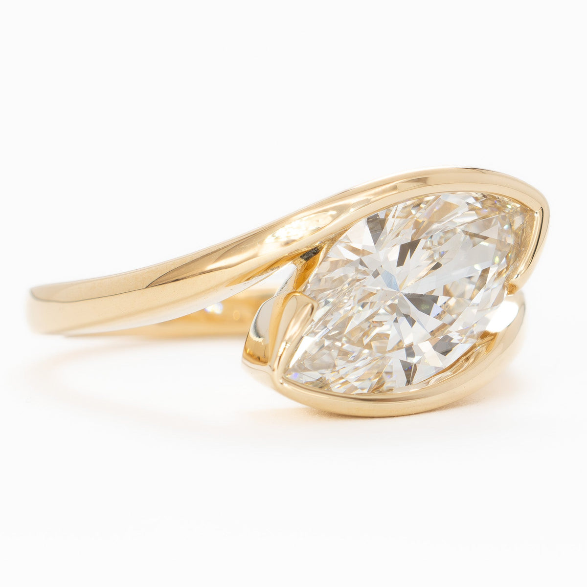 olivia bypass solitaire ring in yellow gold with marquise lab diamond