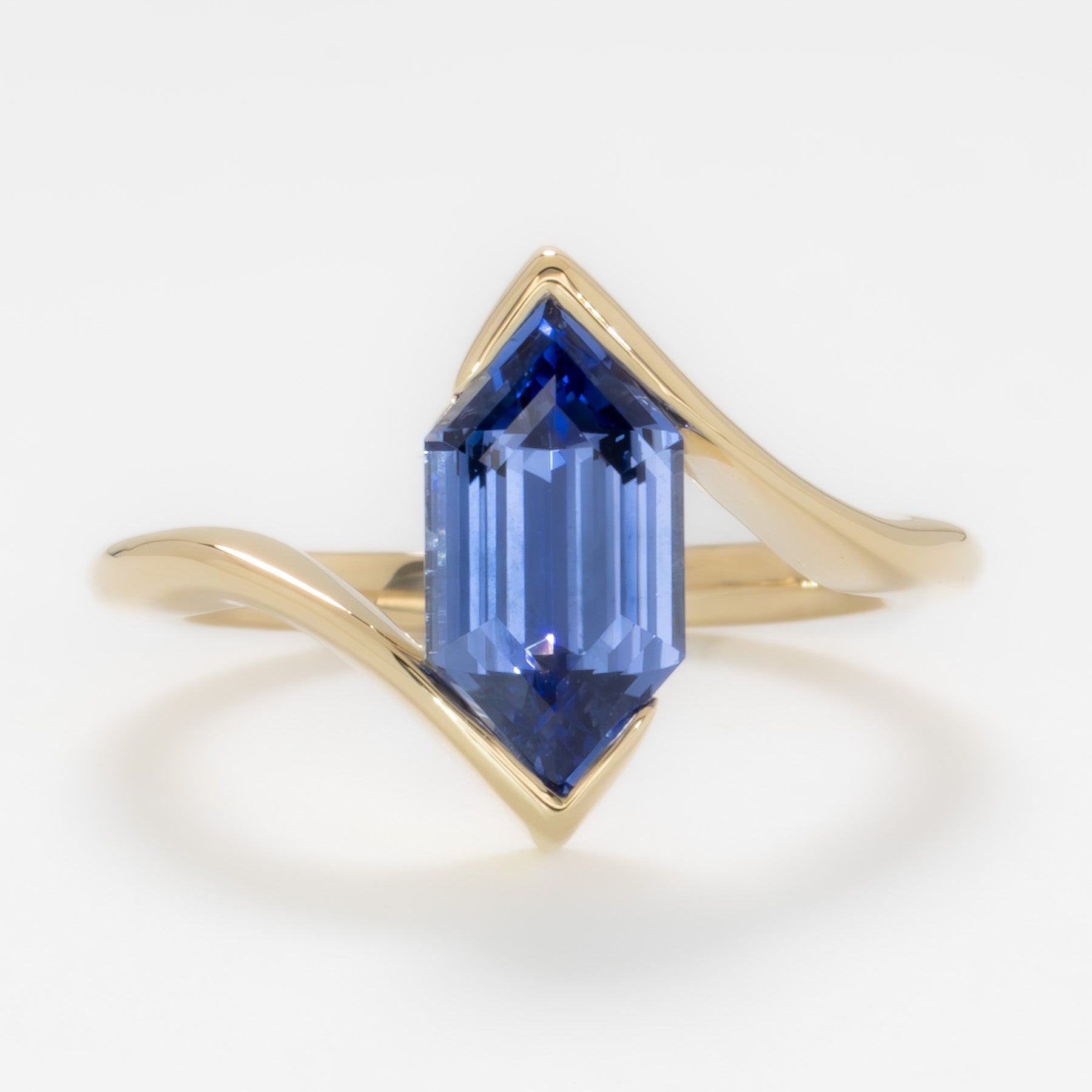 olivia solitaire ring in yellow gold with blue lab sapphire dutch marquise