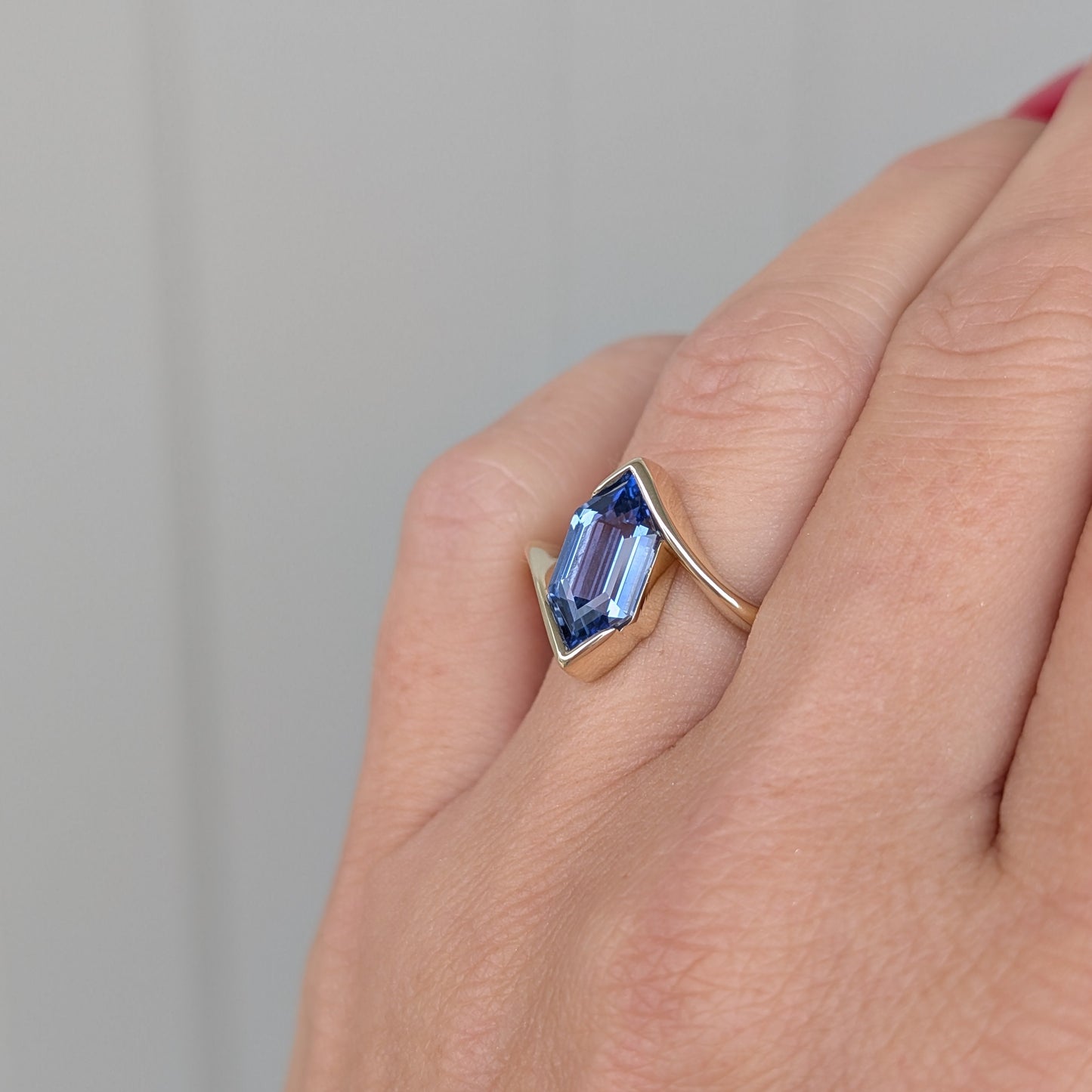 olivia solitaire ring in yellow gold with blue lab sapphire dutch marquise
