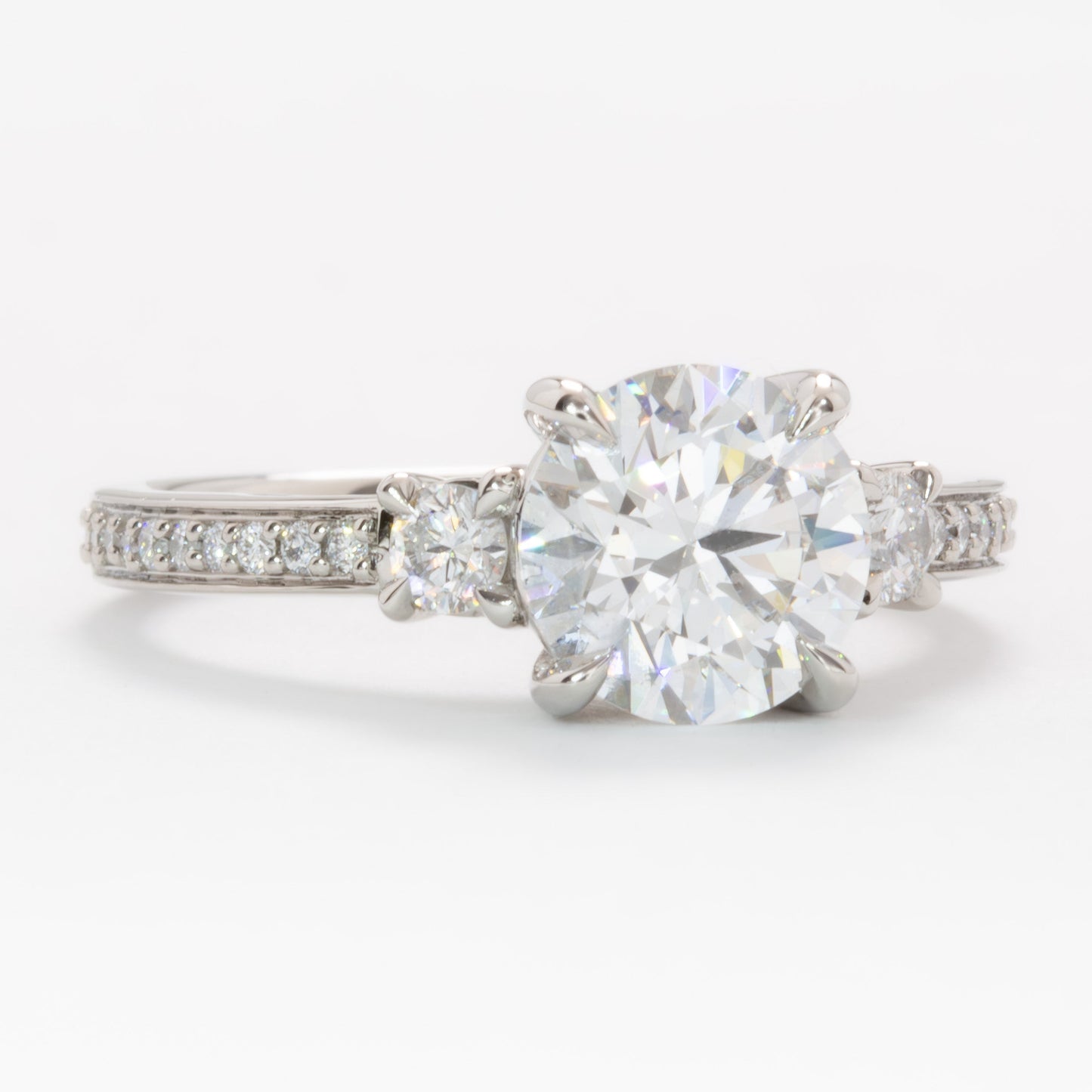 oriane three stone ring in platinum with round lab diamond