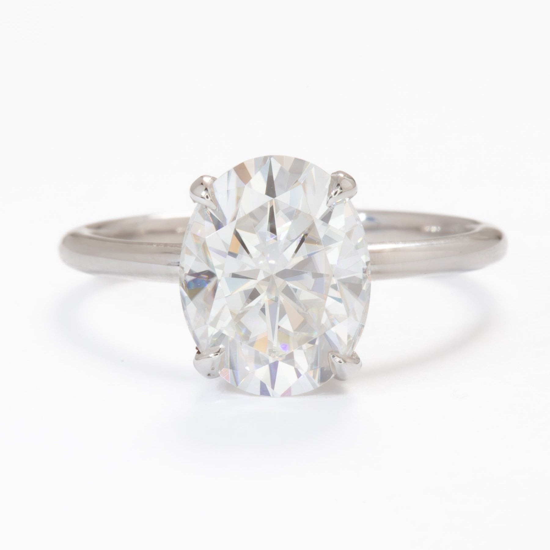 oval moissanite hidden halo engagement ring