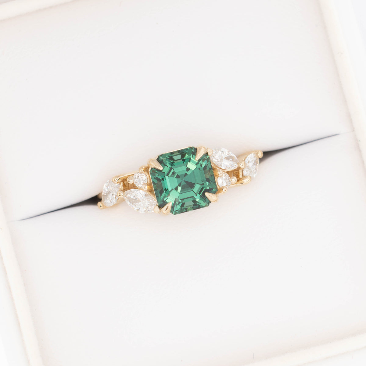 paola accented ring in yellow gold with asscher cut green lab sapphire