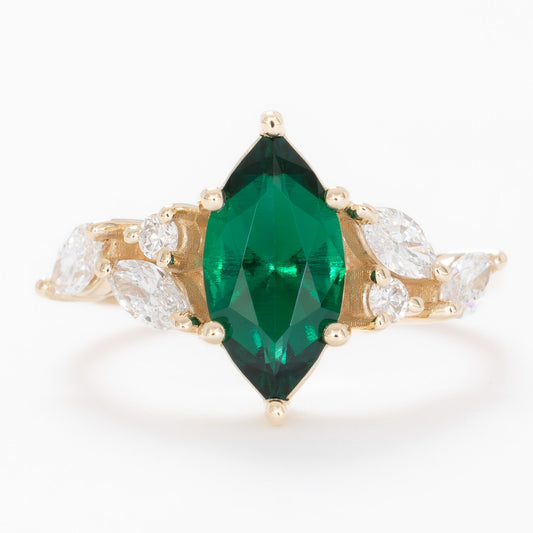 paola engagement ring with marquise lab emerald in yellow gold