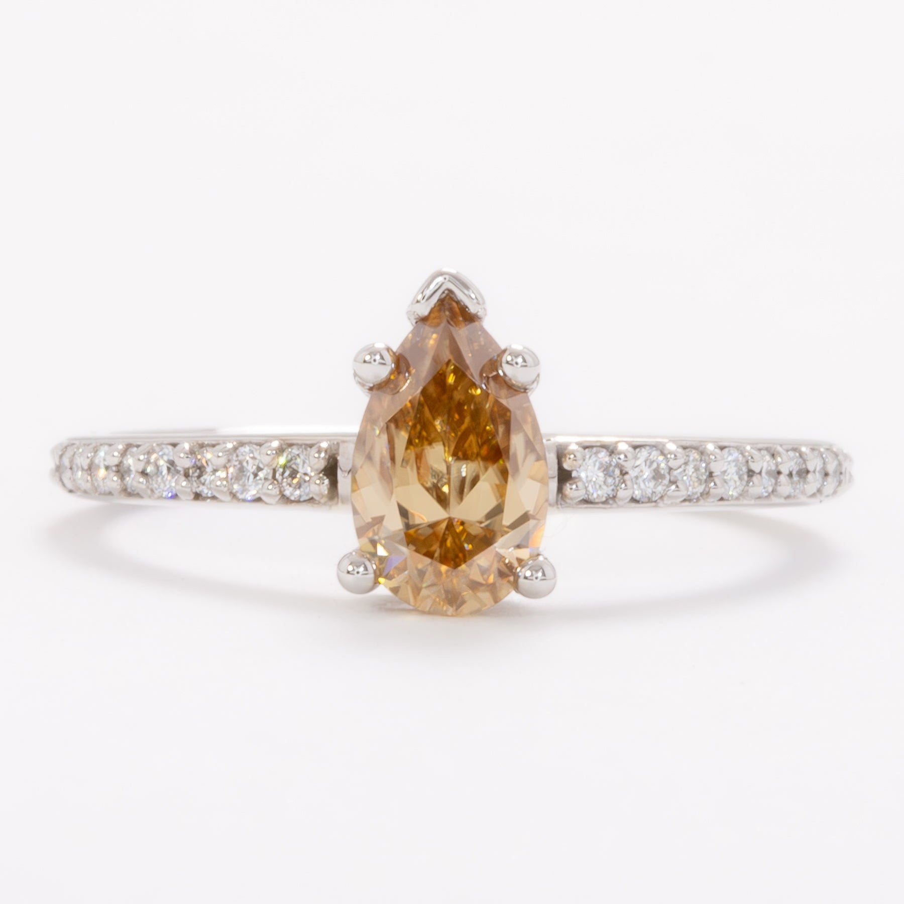 pear gold moissanite engagement ring in white gold