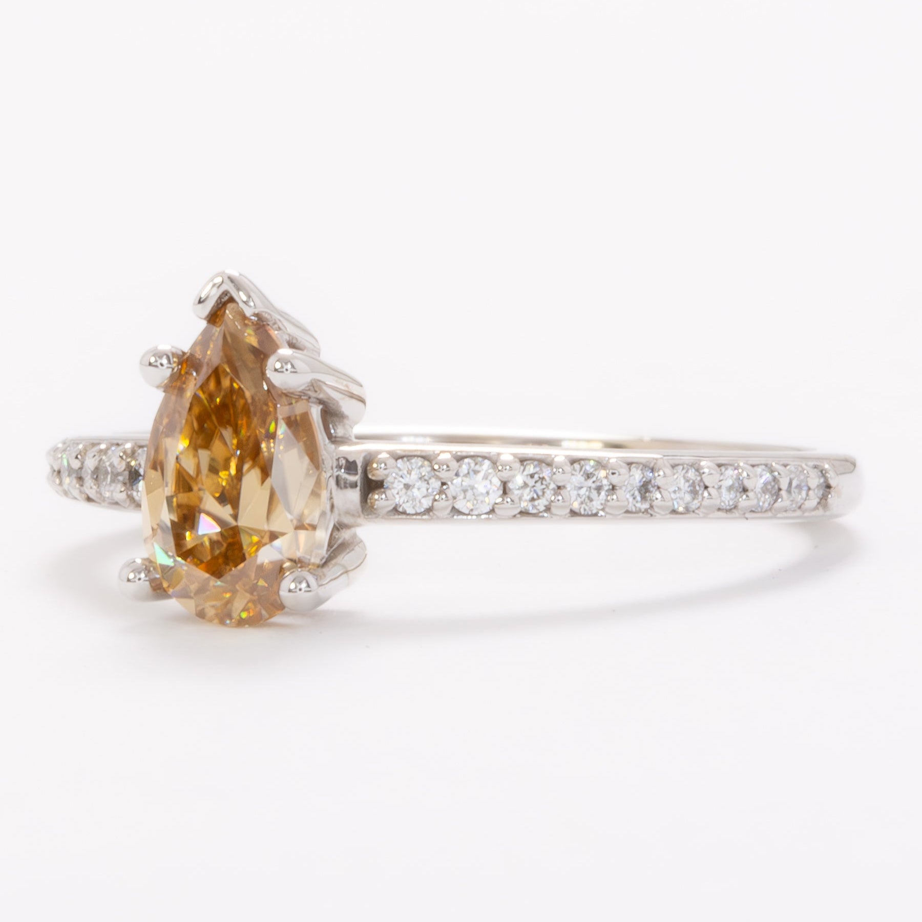 pear gold moissanite engagement ring in white gold