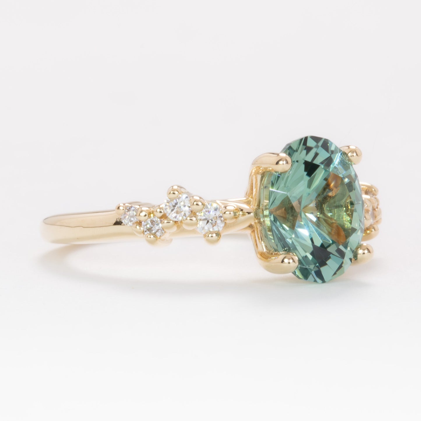 penelope engagement ring in yellow gold with oval green lab sapphire