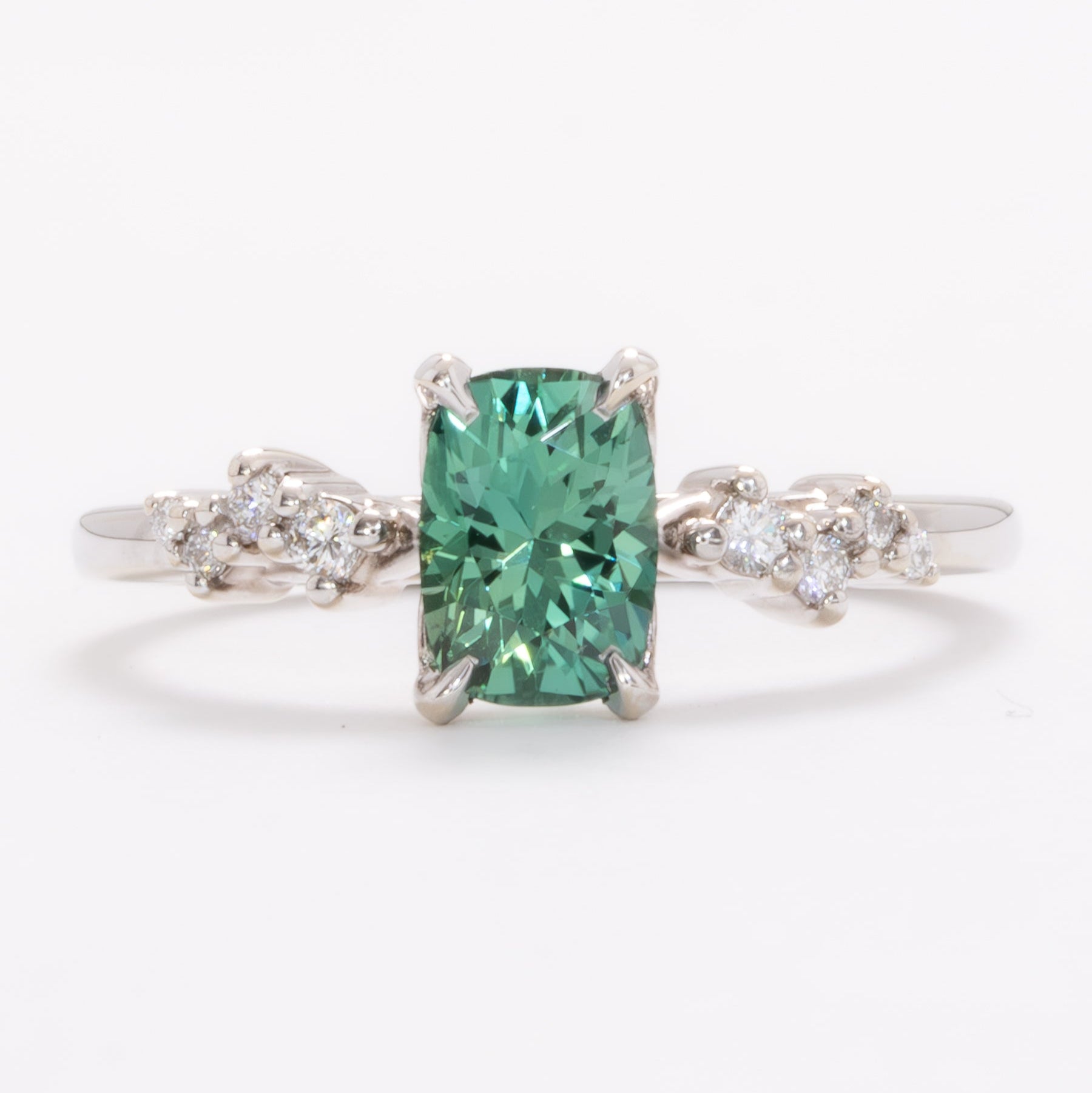 penelope wedding set with elongated cushion green lab sapphire