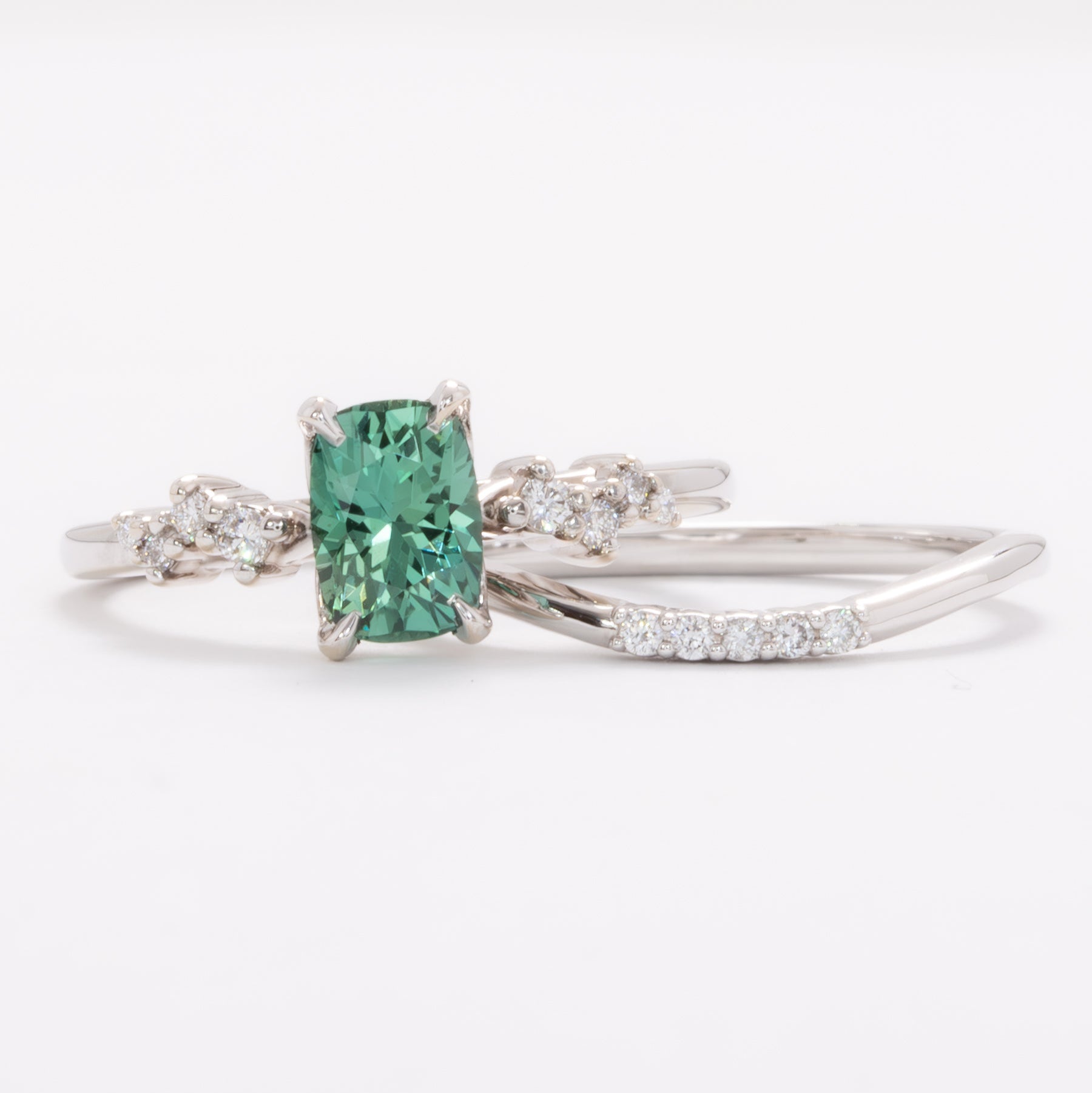 penelope wedding set with elongated cushion green lab sapphire