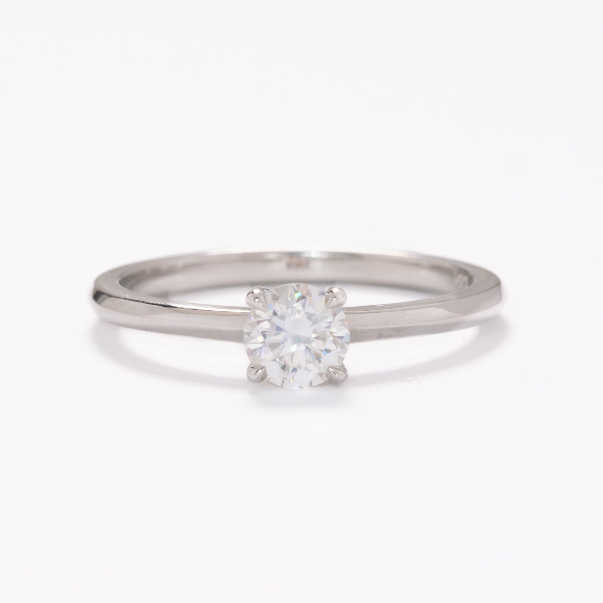petite solitaire with round white moissanite