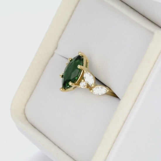 paola accented engagement ring with marquise lab emerald