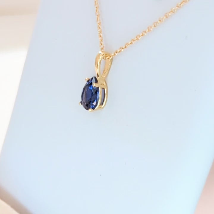 marley necklace in yellow gold and royal blue pear lab sapphire