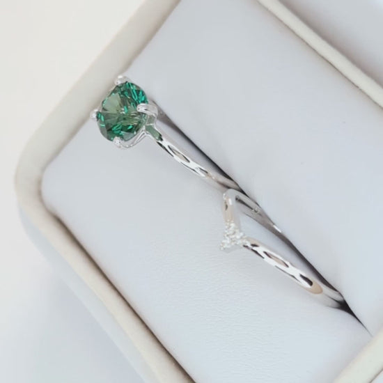 evie engagement ring with green lab sapphire round