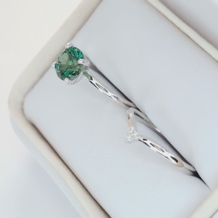 evie engagement ring with green lab sapphire round