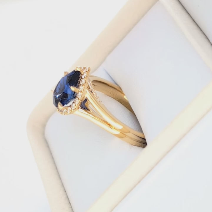 cove halo split shank engagement ring with blue pear lab sapphire