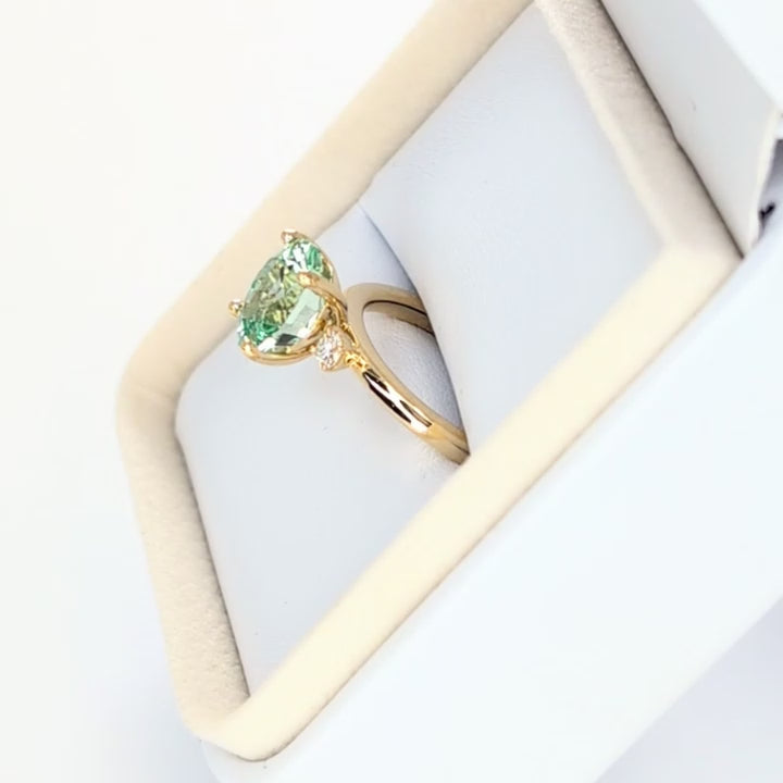 naomi three stone engagment ring with mint oval lab sapphire