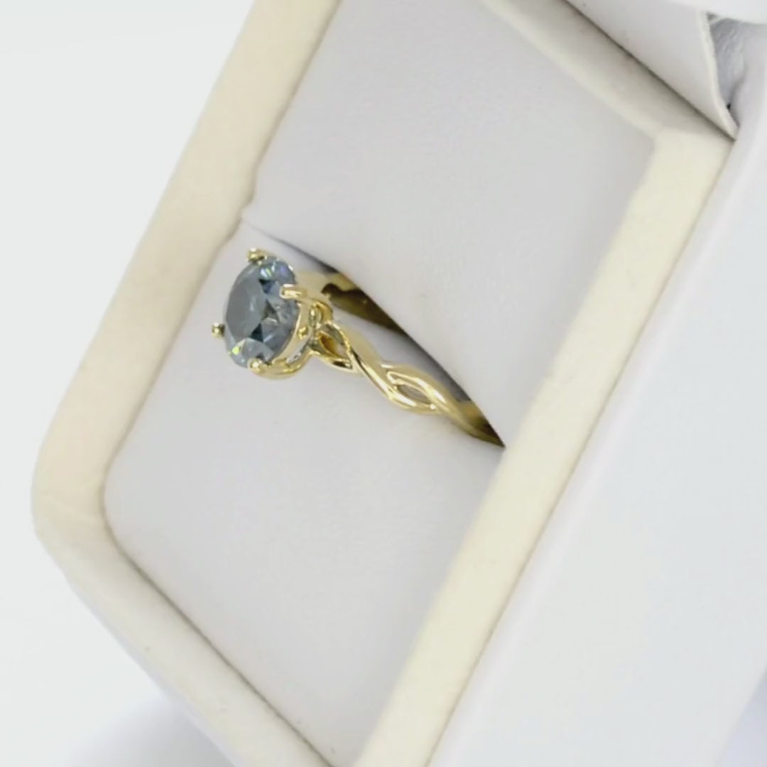 cressida solitaire engagement ring in yellow gold with blue moissanite round brilliant