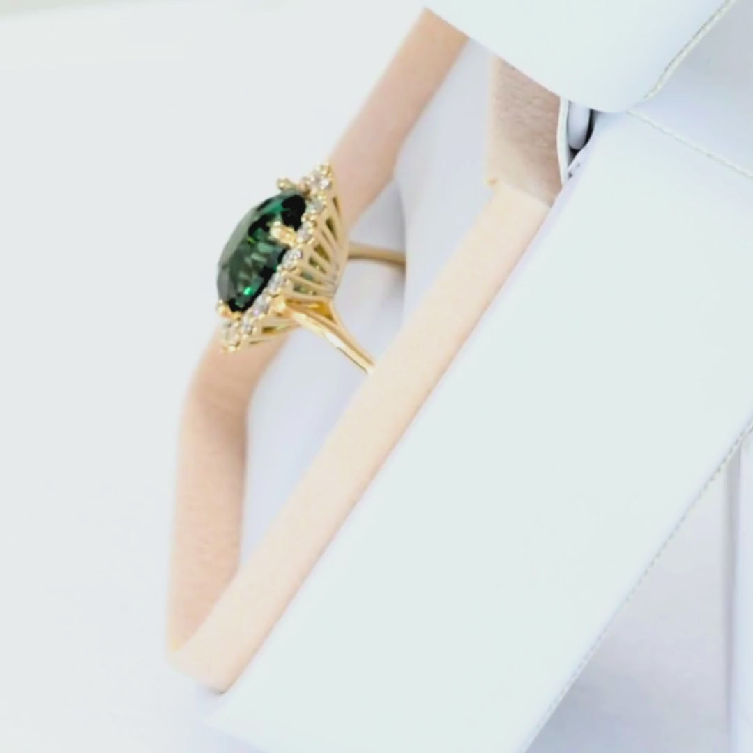 calypso halo ring in yellow gold with oval green lab sapphire