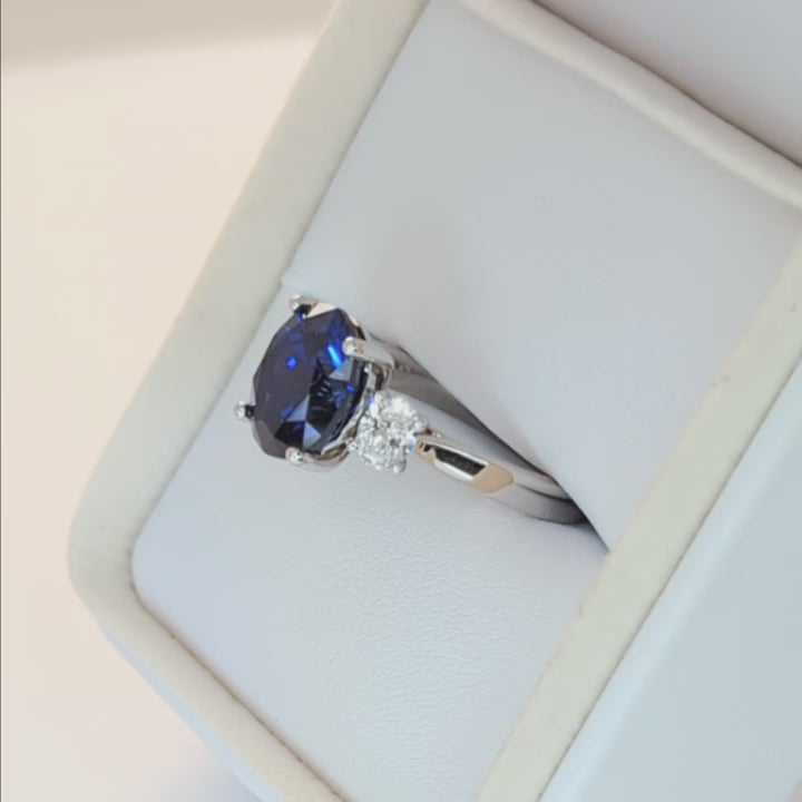 milly three stone engagement ring with oval royal blue lab sapphire