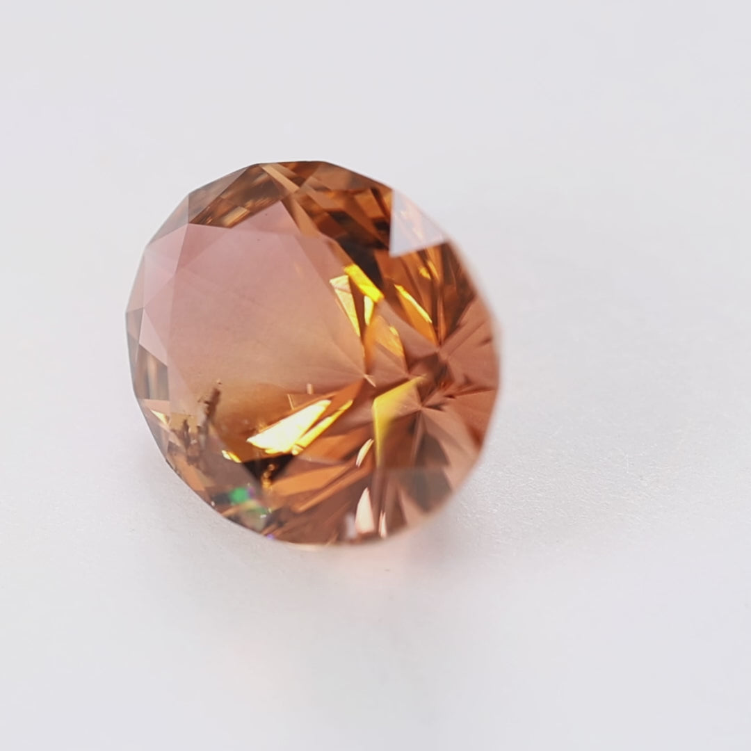 TL0109 13.91ct peach whiskey omni oval tourmaline