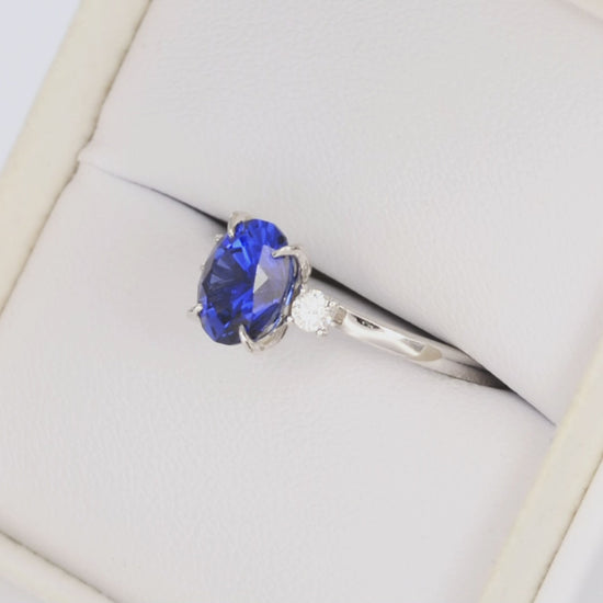 Mable petal basket three stone ring with oval royal blue lab sapphire