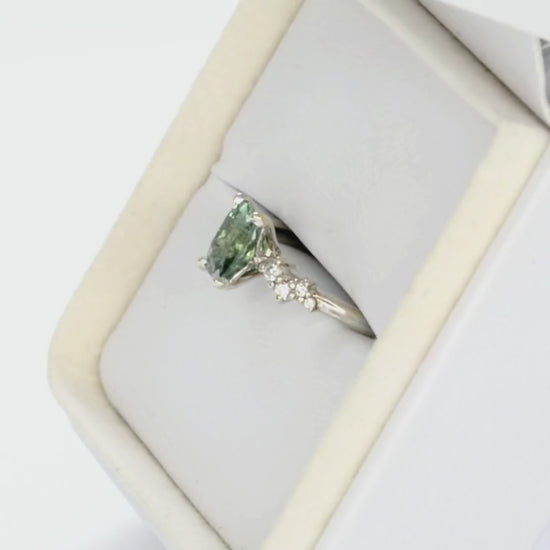 white gold penelope engagement ring with green lab sapphire elongated cushion