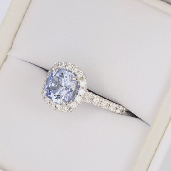 athena halo ring in white gold with light blue cushion lab sapphire