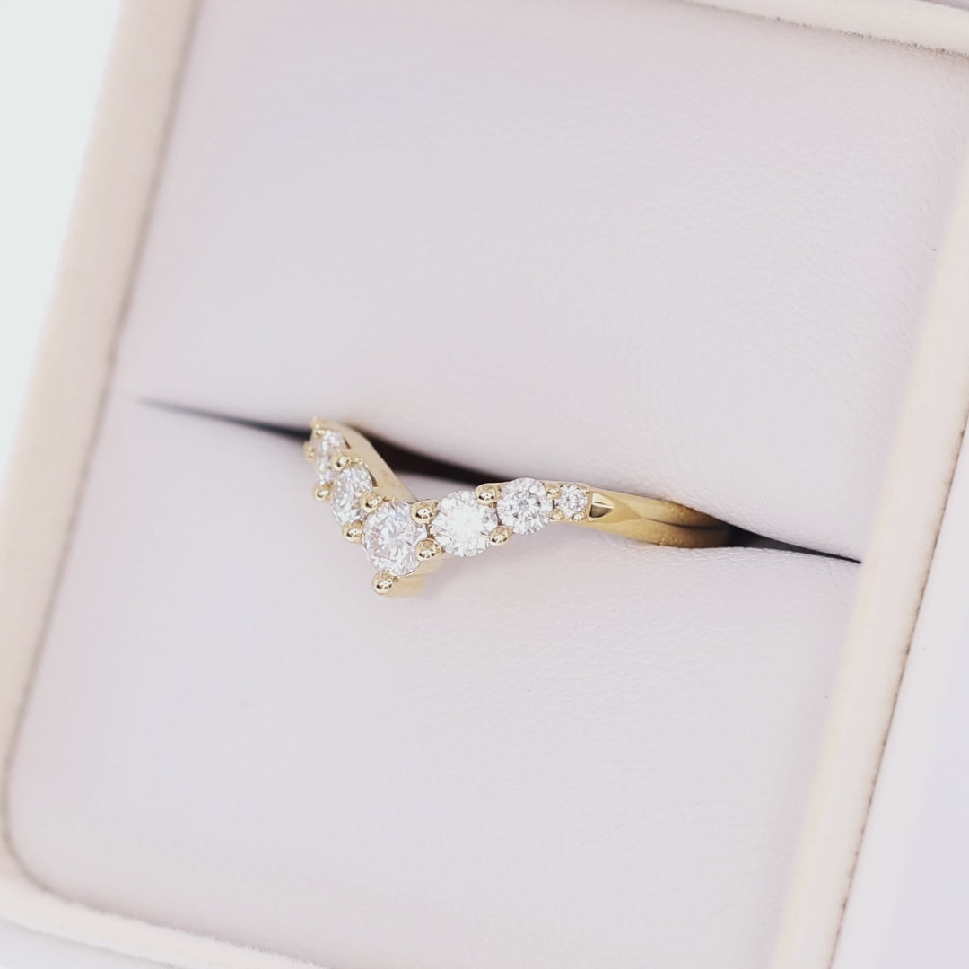 stella contour band in yellow gold with moissanite accents