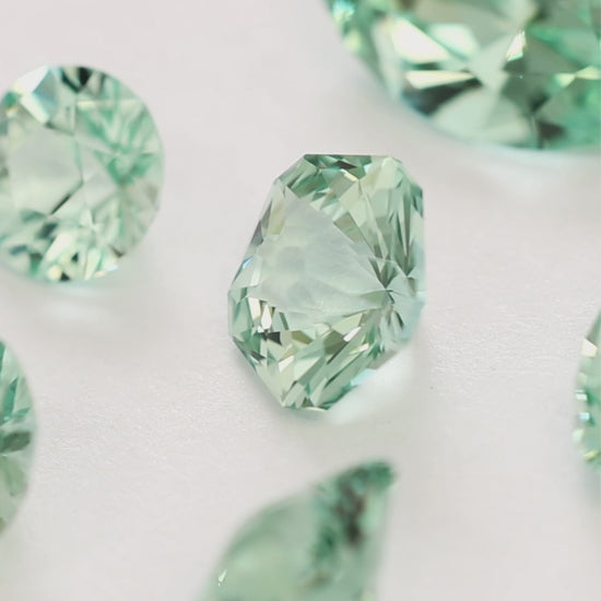 sage green lab sapphire in various cuts