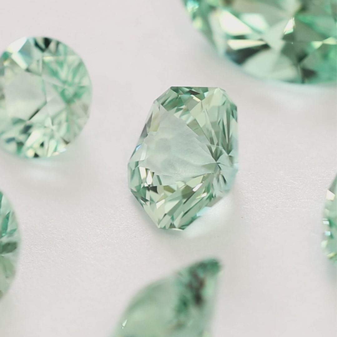 sage green lab sapphire in various cuts