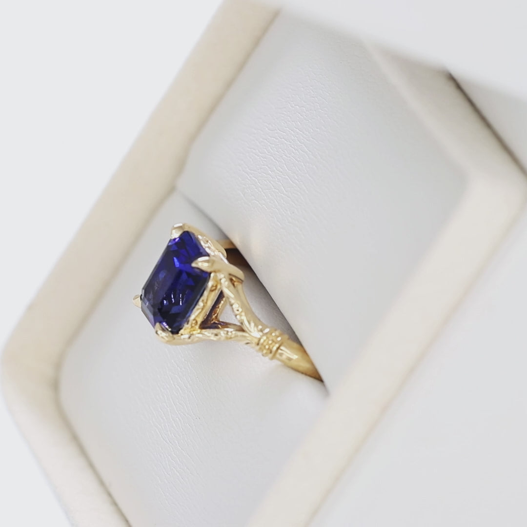 jasmine split shank solitaire ring in yellow gold with radiant royal blue lab sapphire