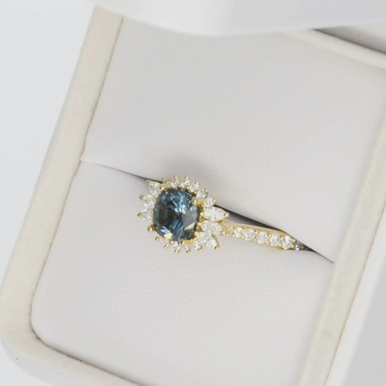 harper halo ring in yellow gold with blue cushion montana sapphire