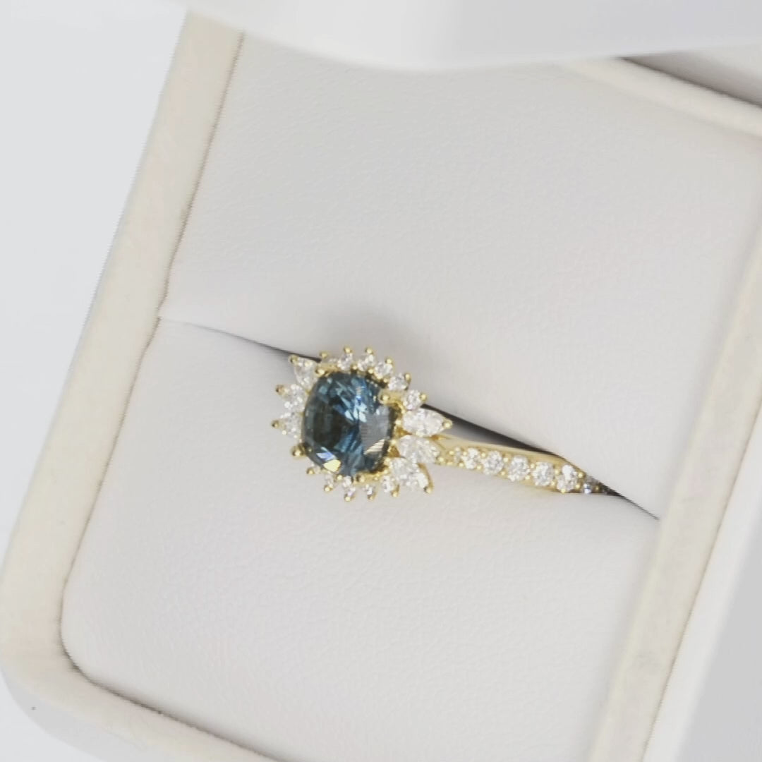 harper halo ring in yellow gold with blue cushion montana sapphire