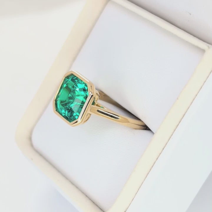 lessie bezel set solitaire with lab emerald asscher