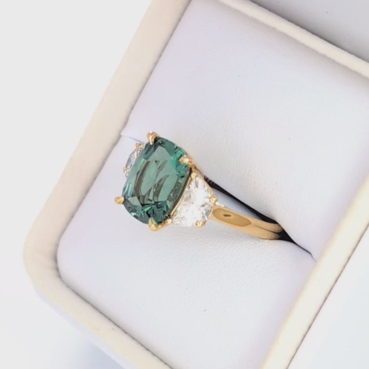 brigid half moon three stone engagement ring with elongated cushion green lab sapphire