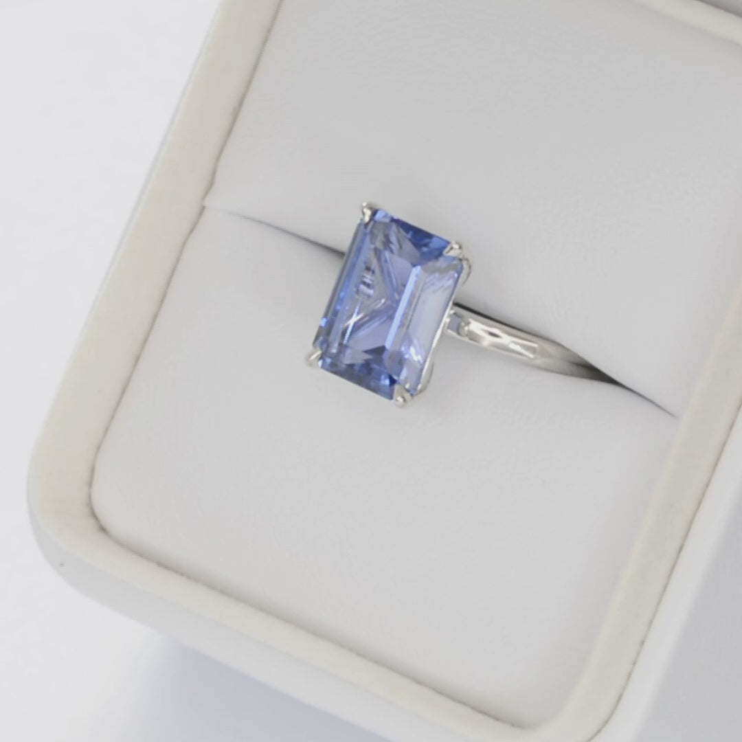 cali solitaire in white gold with blue lab sapphire step cut