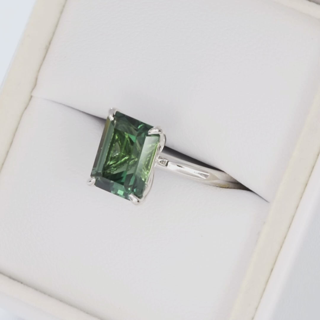 Charmaine solitaire ring in white gold with step cut green lab sapphire